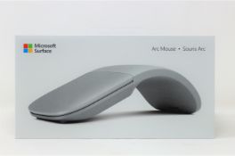 A boxed as new Microsoft Surface Arc Mouse in Light Grey (P/N: FHD-00002) (Box sealed).