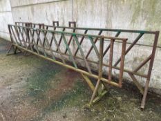 One 16ft 4inch metal feed barrier, free standing and one 18ft 5inch