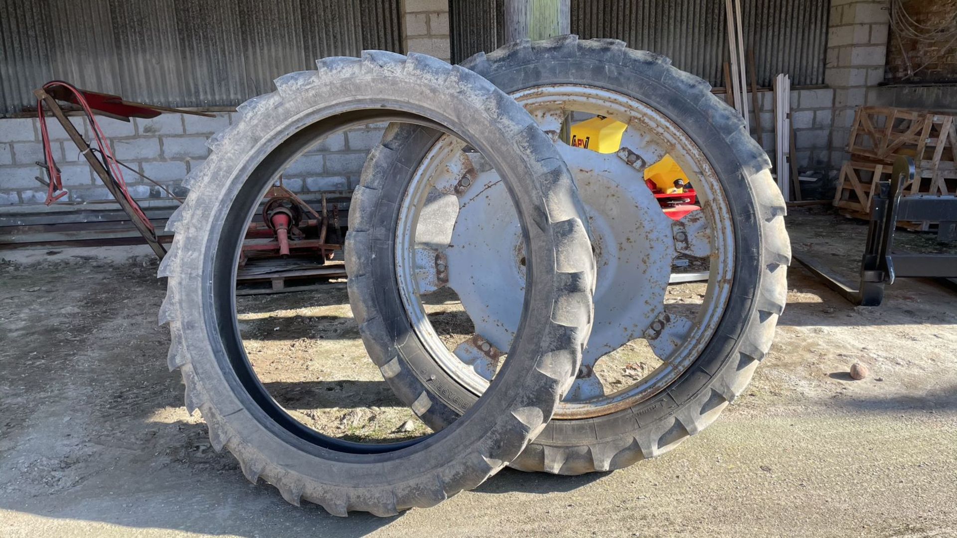 Pair of adjustable row crop wheels plus spare tyres