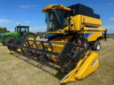 2011 New Holland CSX7060 combine harvester with 20ft Varifeed header on 800/65R32 front and 16.0/70-