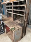 Metal workbench with pigeon holes and vice