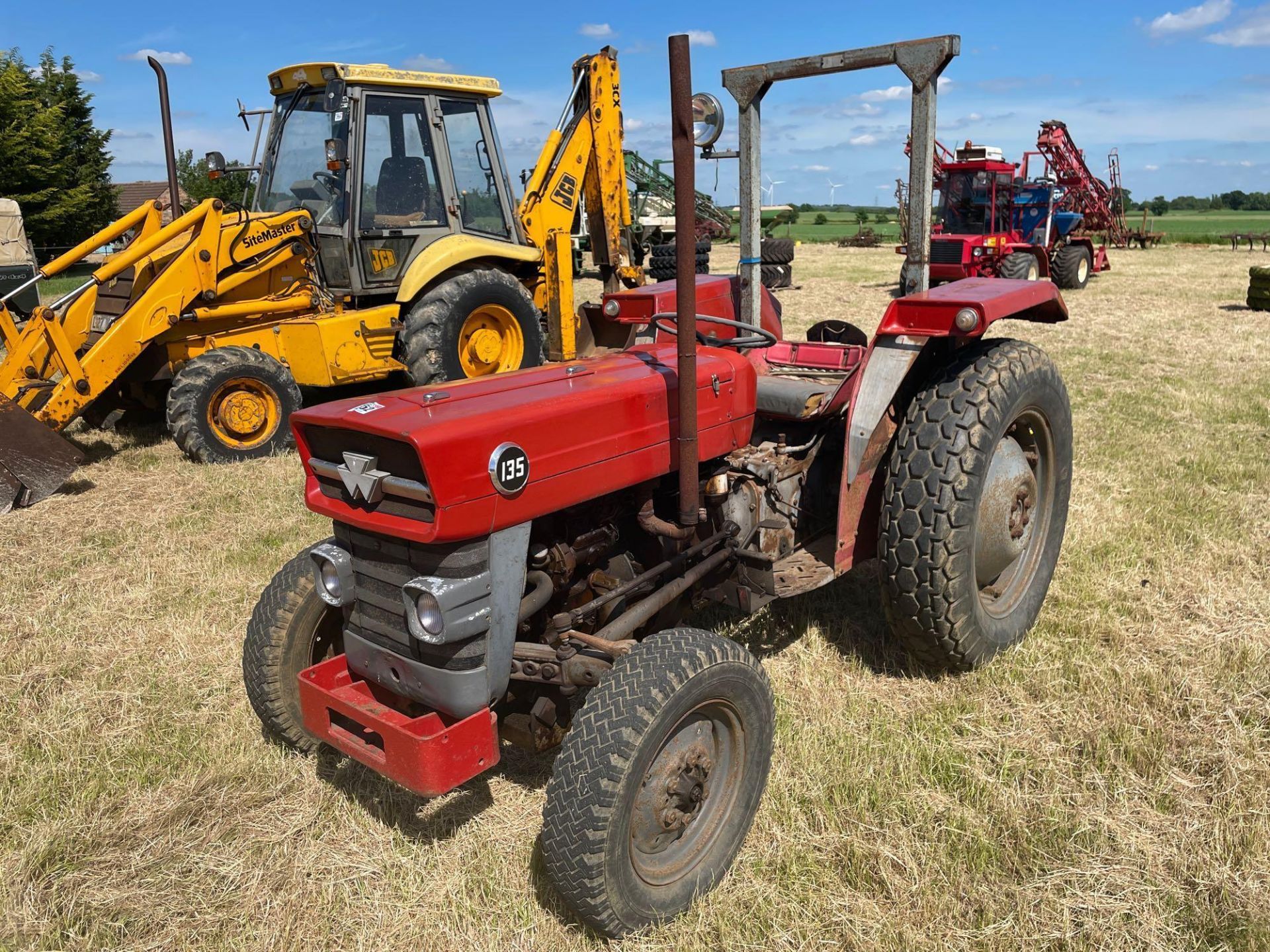 Massey Ferguson 135 2wd tractor with roll bar on 205R16 front and 12.4-28 rear wheels and tyres, die