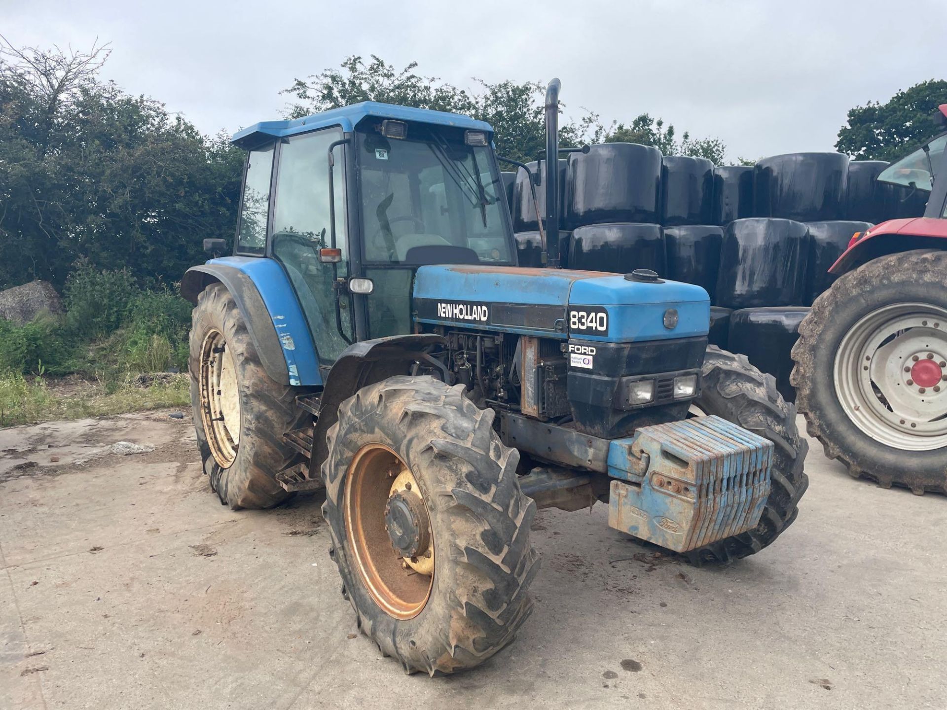 1997 New Holland 8340 4wd tractor with 2 manual spools on 14.9R28 front and 18.4R38 rear wheels and
