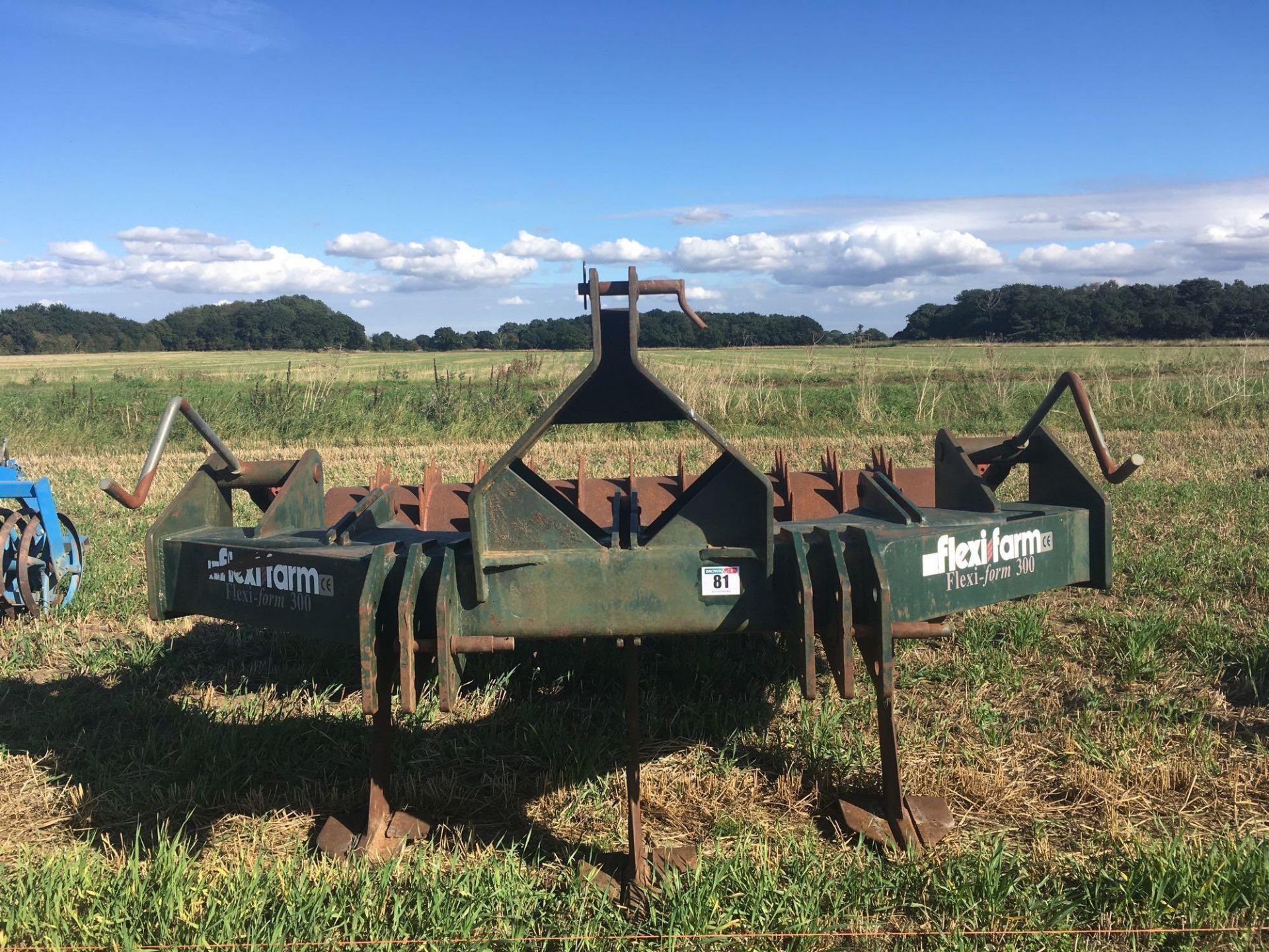 Flexi–Farm flexi form 300 3 leg V form subsoiler and packer roll.