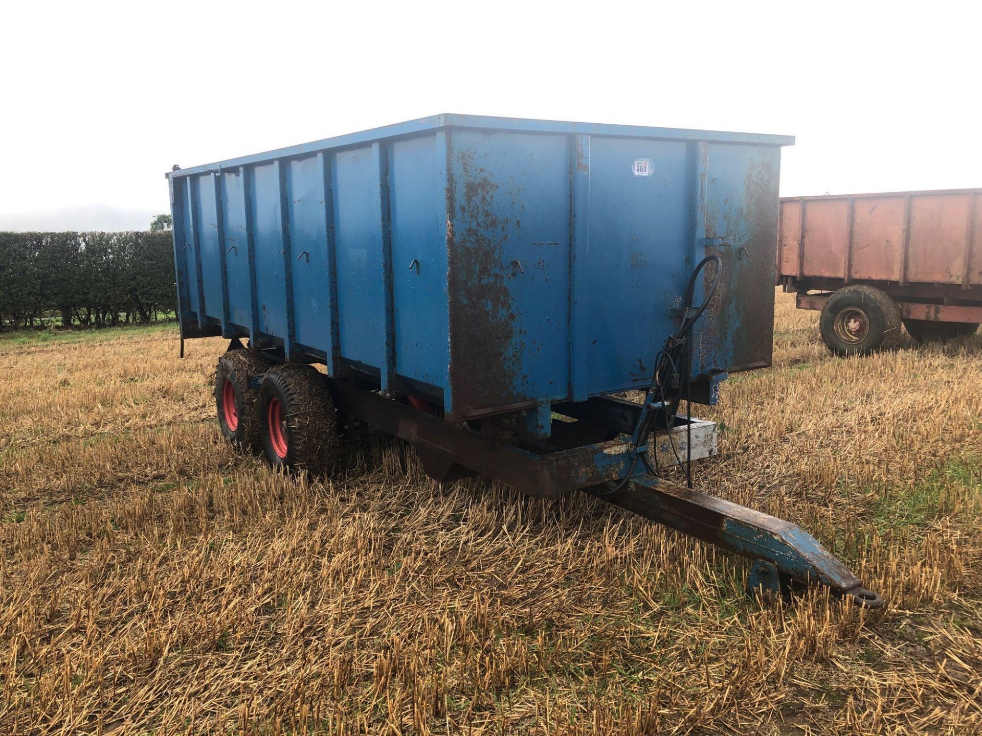 8t twin axle trailer with manual rear door and grain chute. C/w silage sides. On 12.5/80-15.3 wheels