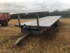 Scalin twin axle 28ft flat bed trailer with wooden floor.