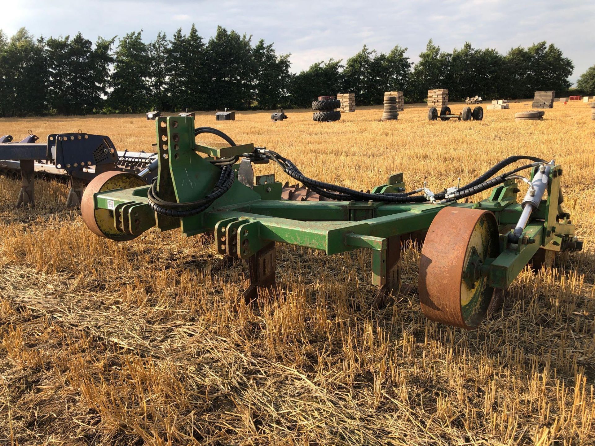 Cousins V-Form 5 leg soil loosener with hydraulic depth wheels and hydraulic adjustable rear packer. - Image 2 of 8