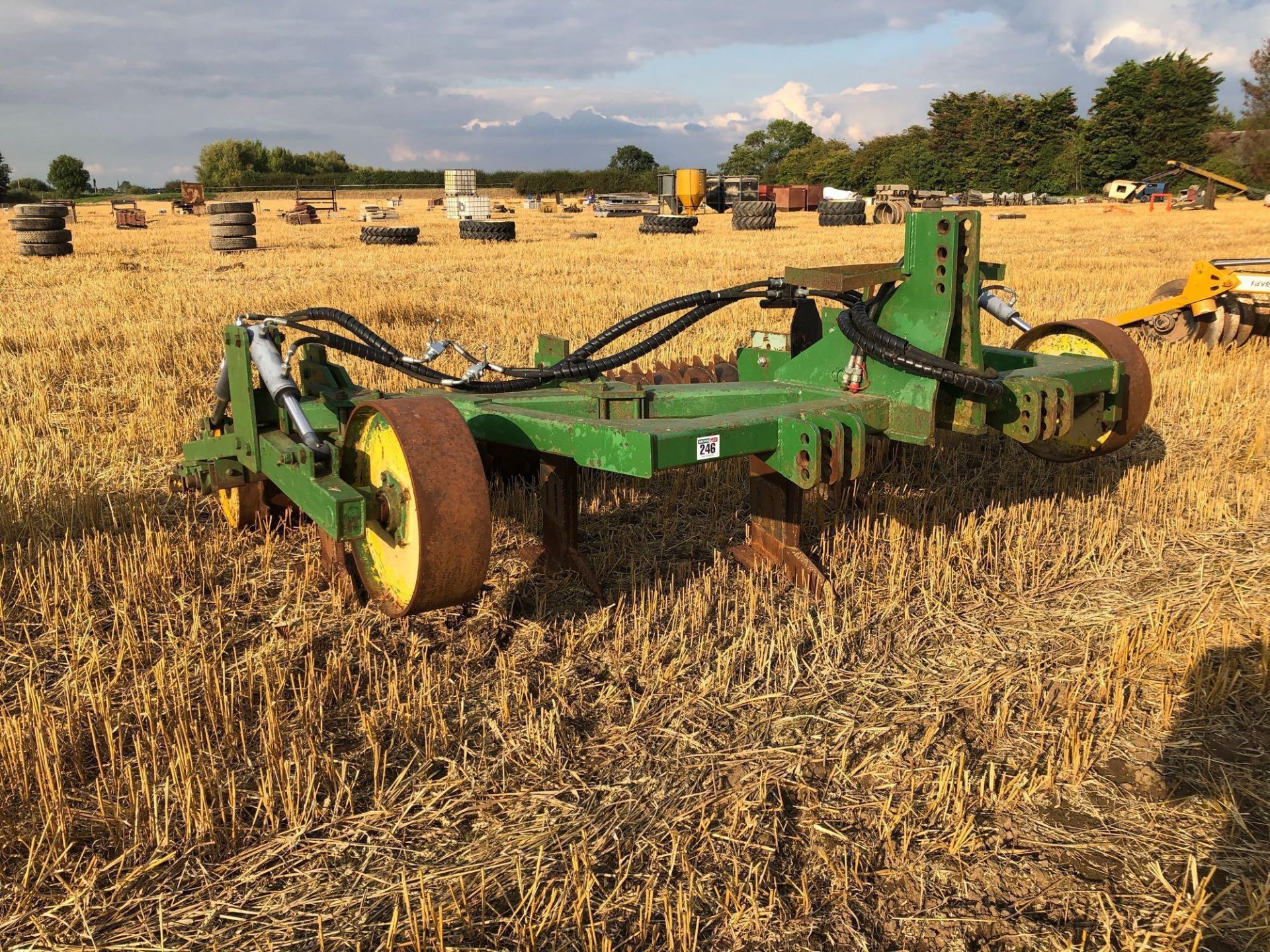 Cousins V-Form 5 leg soil loosener with hydraulic depth wheels and hydraulic adjustable rear packer.