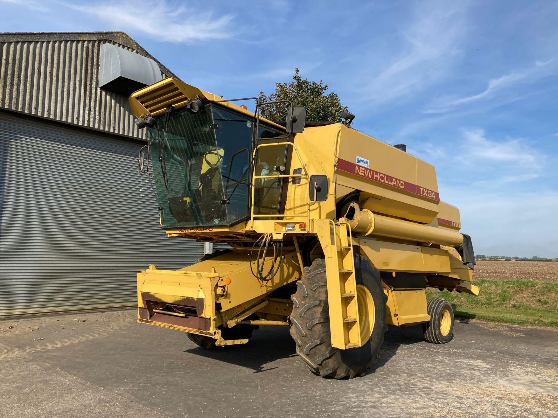 1990 New Holland TX34, 17ft header, on Goodyear 23.1-30 front and 13/65-18 rear wheels & tyres, Reg