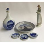 A small quantity of Royal Copenhagen ceramics; together with an NAO figurine of a girl holding a