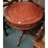 An Asian hardwood drum table, two drawers on turned column and cabriole legs, 53x63cmH