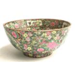 A large 20th century Chinese famille rose bowl, decorated with floral panels and a court scene,
