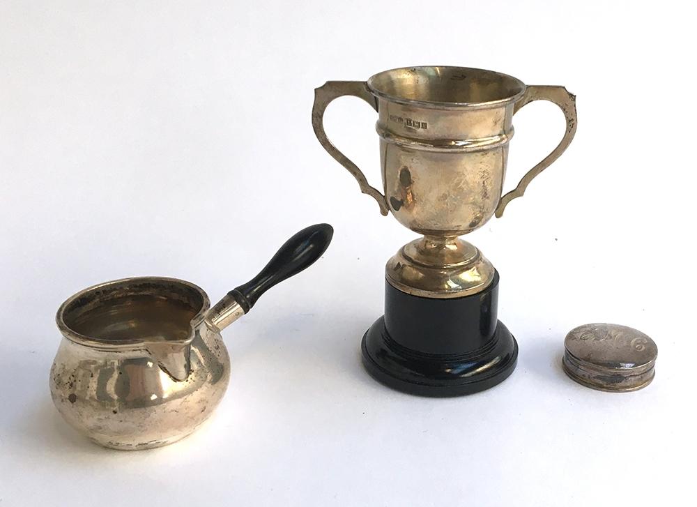 A small trophy cup by Joseph Gloster Ltd, Birmingham 1966, 10cm high; a small silver jug with turned