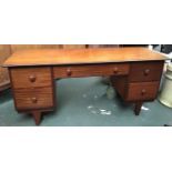 A mid-century style kneehole sideboard, central drawer flanked by four further drawers, 145x49x65cmH