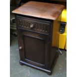 An oak 20th century bedside cabinet, carved detail, single drawer over cupboard door, 40x32x66cmH;