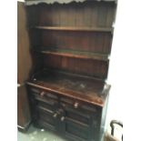 A small 20th century dresser, shelves above drawers and cupboards, 107x46x183cmH