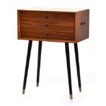 A mid century side table, having three drawers, on ebonised dansette legs, 56x34.5x78cmH