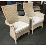 A pair of wicker conservatory chairs