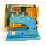 A Vulcan Junior sewing machine in original box