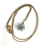 18ct gold chain with a small flower cluster pendant set with aquamarines, gross weight 2.9g, approx.