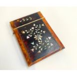 A Victorian tortoiseshell and mother of pearl inlaid card case, approx. 11x8cm