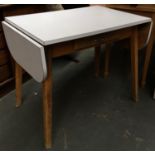 A formica topped white drop leaf table on splayed legs, 90x60x75cmH