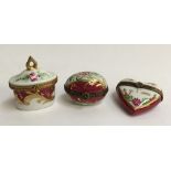 A set of three Limoges peint main trinket boxes, with floral burgundy design, heightened in gilt,
