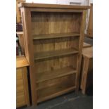 A contemporary oak bookshelf of four shelves, 97x30x155cm; together with a smaller shelf of six