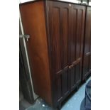 A Mid century hardwood hanging wardrobe with shelves, fielded door detail, bears label A. Younger