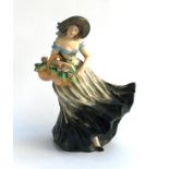 A continental ceramic figurine of a girl