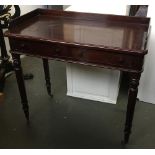 A stained oak three quarter gallery desk, having two frieze drawers, on turned legs and brass