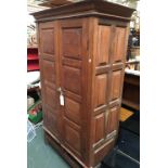 A hardwood panelled cupboard, interior with deep shelves, over two drawers, 115x56x196cmH