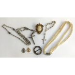A small lot of jewellery, to include several crucifixes, a set of Rosito pearls, a Florenza cameo