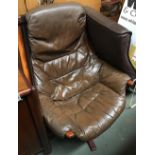 A 1970s leather swivel armchair