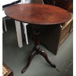 An oval mahogany tripod table, 61x45x76cm