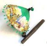 An East Asian parasol with chased white metal handle, within a cylindrical tin storage case