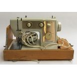 A Crownpoint electric sewing machine, in carry case