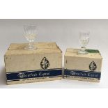 A boxed set of six Waterford Colleen cut crystal wine glasses; together with a boxed set of six matc