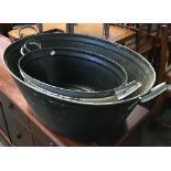 One large and two smaller galvanised vintage wash pans, approx. 88cmL and 62cmL