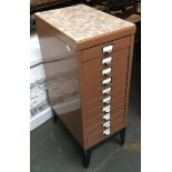 A vintage metal filing cabinet having ten drawers, 40x28x75cmH