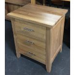 A light oak bedside table of three drawers, 51x40x61cmH