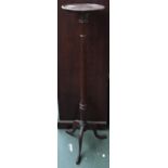 A 20th century mahogany pot stand, 122cmH