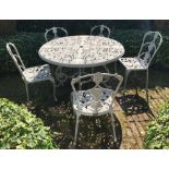 An Oxley's set of six metal garden chairs, with cabriole legs and removable cotton fabric cushions