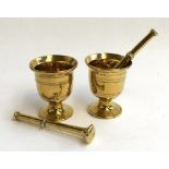 A pair of brass pestle and mortars, approx. 11cmH