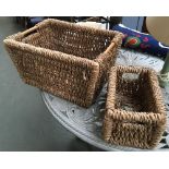 A rectangular rush log basket, 55cmW; together with one other smaller