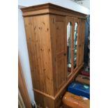 A four door pine wardrobe, central doors with mirrors, over four drawers, approx. 178x53x93cmH