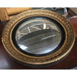 A modern circular convex wall mirror, within acanthus moulded frame, 42cmD