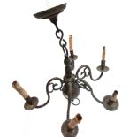 A four arm chandelier, together with a pair of two arm brass candlestick, fittings etc