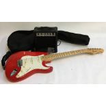 A Rockburn Stratocaster guitar, with soft case, together with Rockburn FG-10 practice amp, with