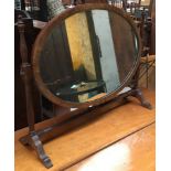 A 19th century oval mahogany dressing mirror, 52cmH